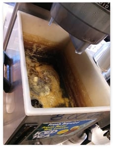 iced tea urn showing buildup on the walls of the urn