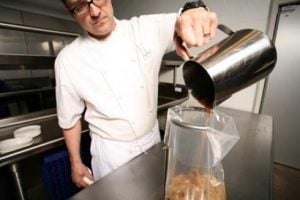 Cook Chill pouring into bag on ring stand